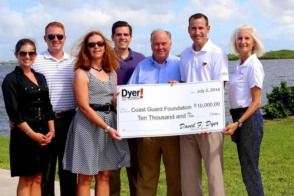 The Dyer family- left to right:  Tatiana and Will Dyer, Harriet Dyer, John Dyer and David Dyer, with Coast Guard Foundation’s regional director Brian Overcast and Coast Guard Foundation board member VADM Sally Brice-O’Hara, USCG (Ret.).  The $10,000 gift from Dyer Chevrolet, Ft. Pierce Florida was presented today to the Coast Guard Foundation to fund kayaks, stand-up paddleboards, and camping and fishing gear for the 45 active duty members and 15 reservists, and their families based at this Coast Guard station.  © Debbie Rosenberg